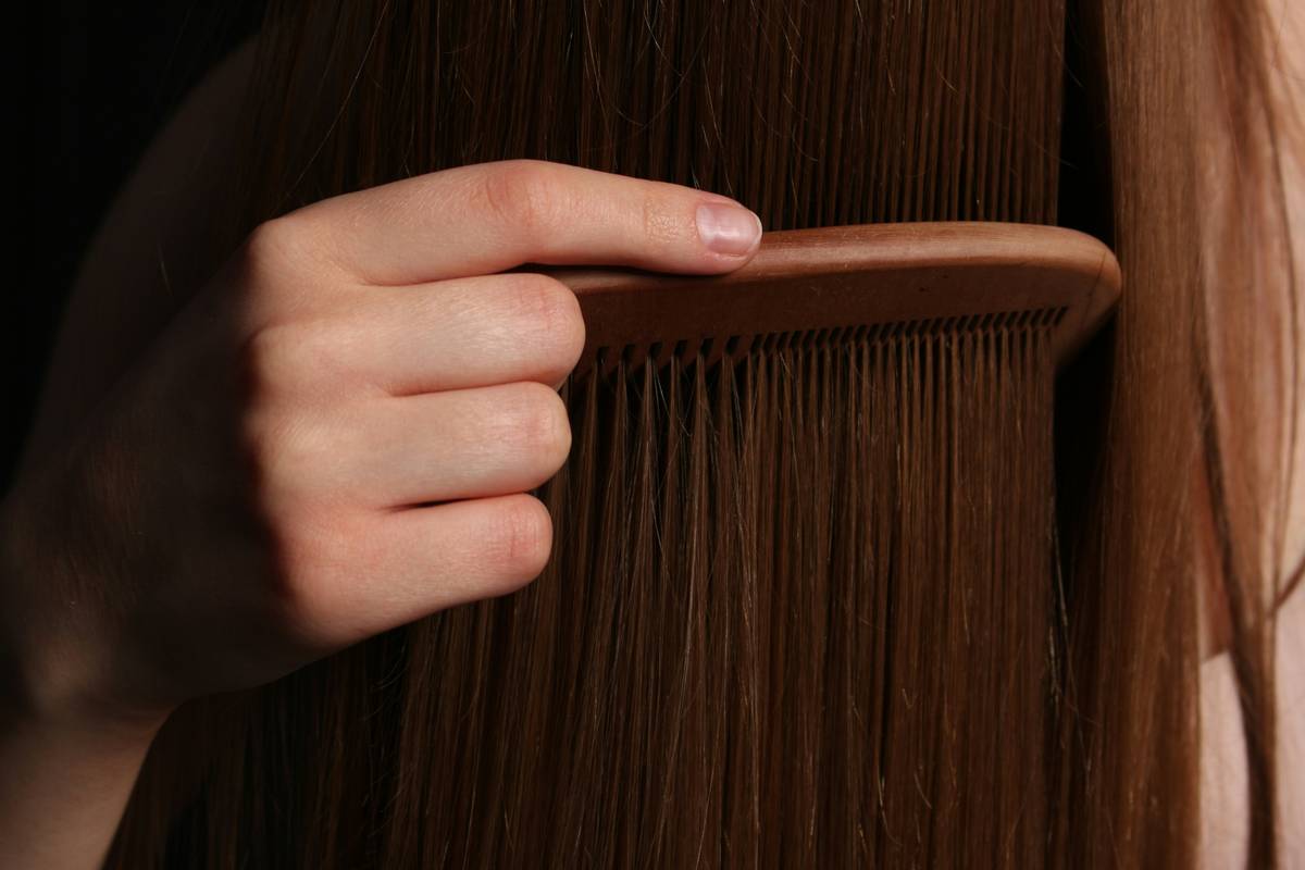 Hair Health Focus demonstrated by gentle finger detangling before braiding